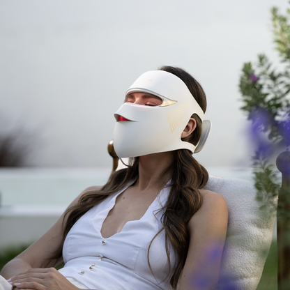 User comfortably lying with Megelin Duo-Lux mask, enjoying full-face light therapy at home for anti-aging and skin rejuvenation